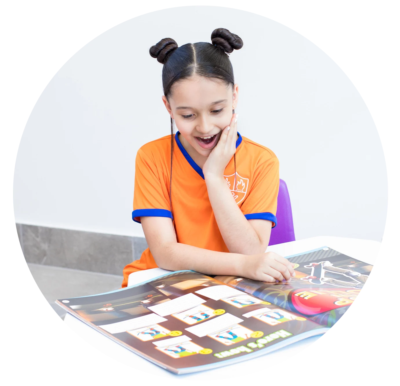 Instituto San Gerardo student amazed in front of a card game