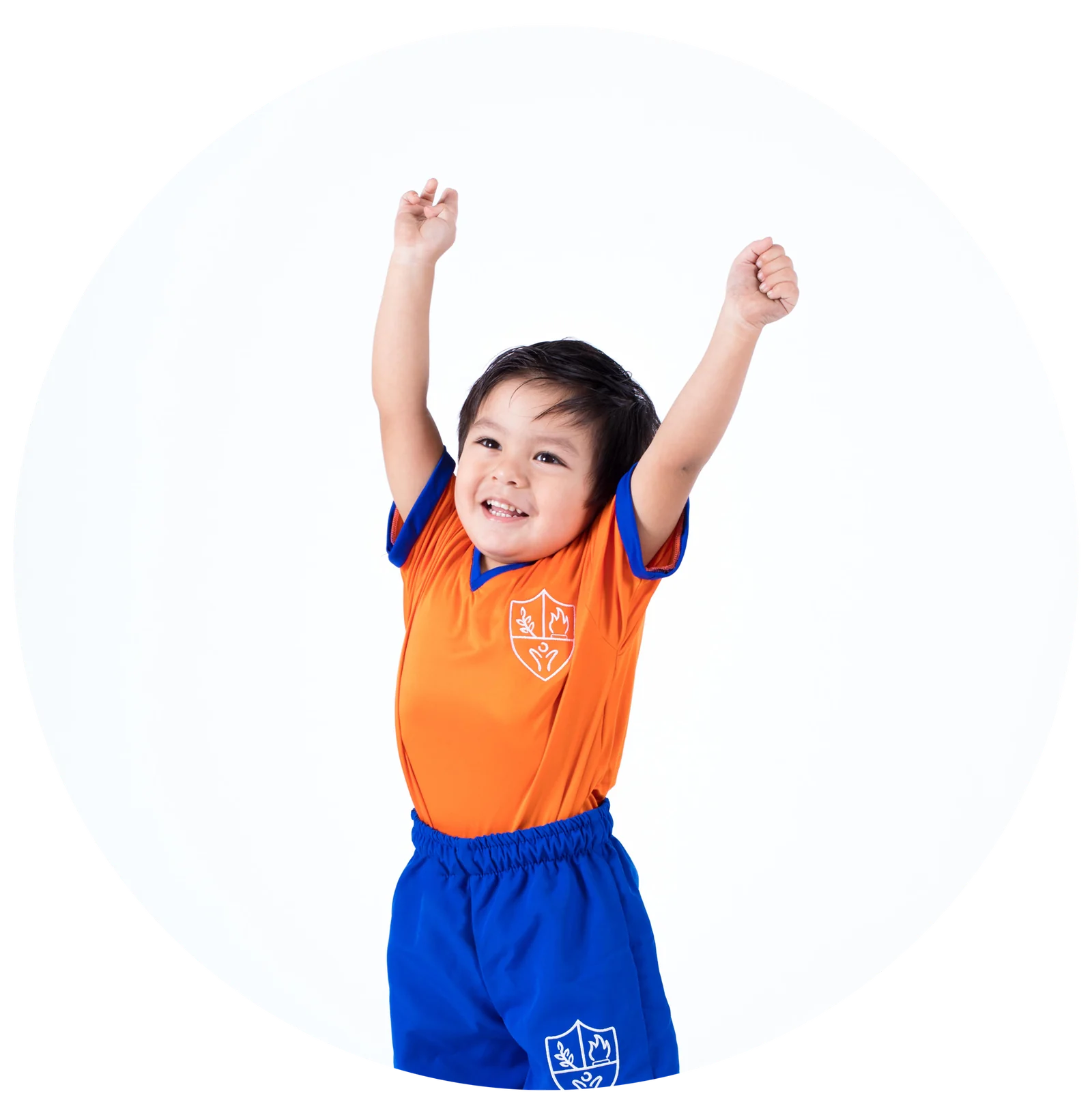 Preschool child hanging from a wooden frame in the sensory-motor gym
